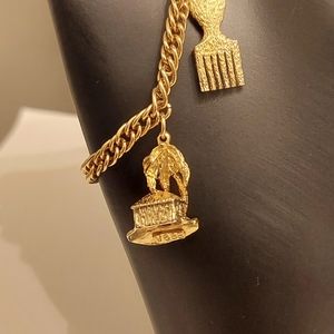 Gold tone tropical charm bracelet